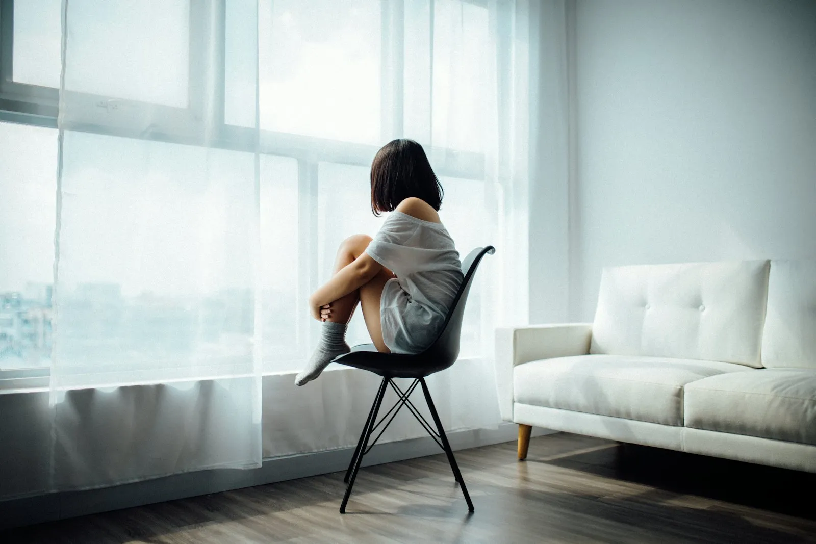 A calm therapy office setting with chairs and soft lighting
