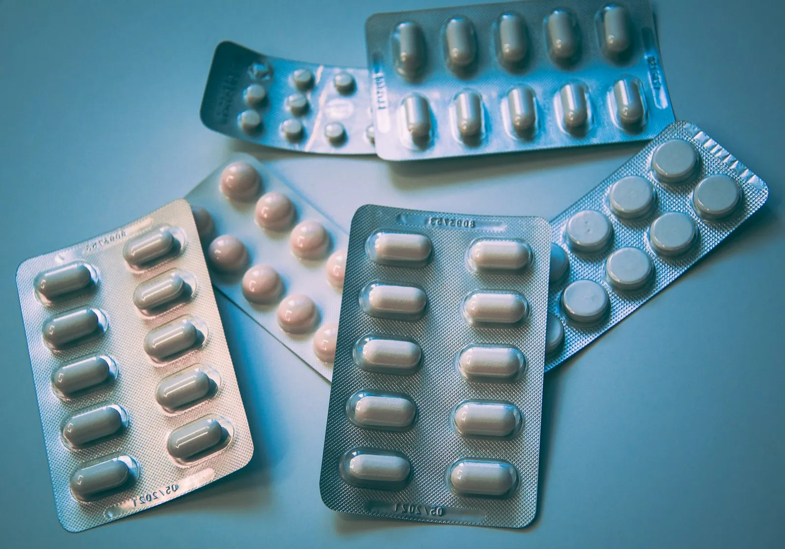 A close-up of medication bottles on a counter