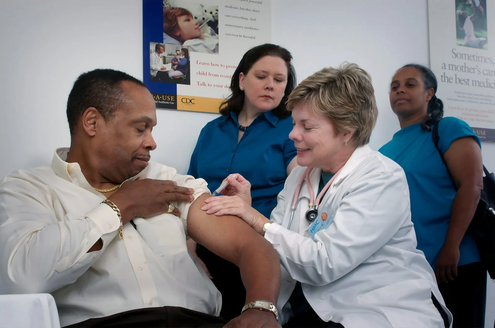 A nurse checking a patient’s blood pressure in a clinical setting